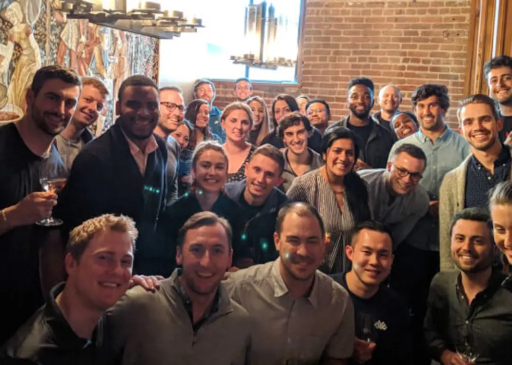 a group of people are posing for a picture