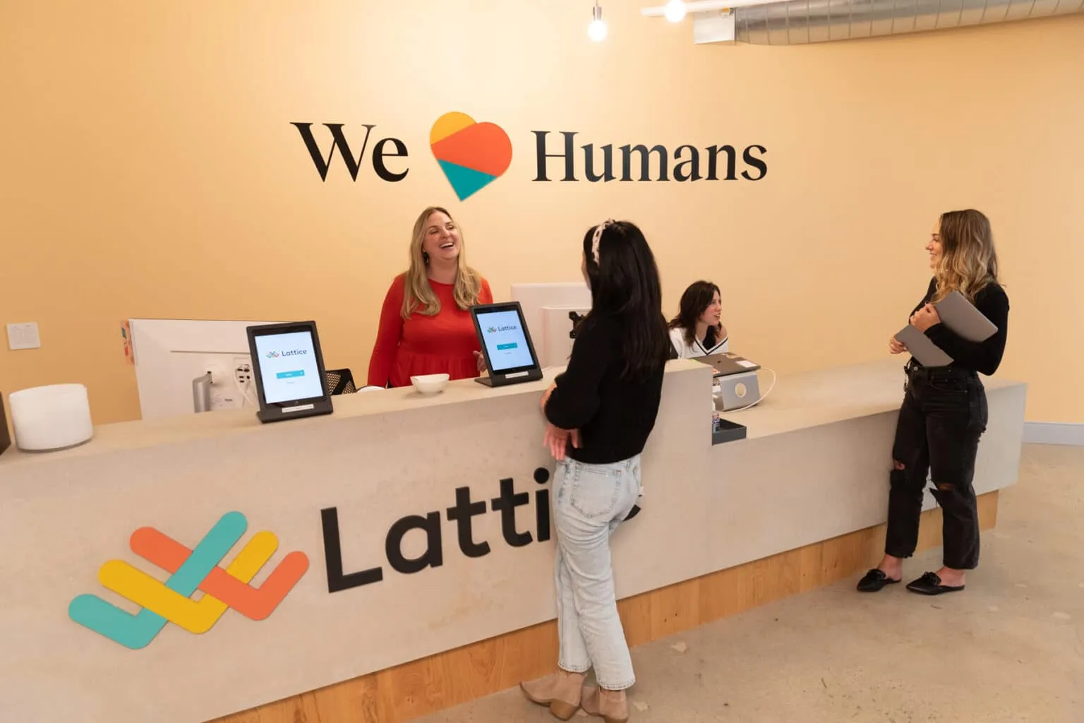 a group of women standing at a counter